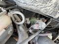 2010 Freightliner MT45 Garbage Truck engine components including hoses wires and a valve assembly