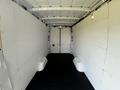 Interior of a 2022 Mercedes-Benz Sprinter van featuring white walls and a black floor with no cargo present