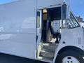 A 2007 Freightliner MT55 step van with an open door showing the driver’s seat and interior space