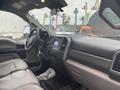 Interior view of a 2021 Ford F-550 featuring leather seats a central touchscreen display and control panel with various buttons and knobs