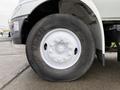 A close-up of the tire of a 2007 International 4200 truck showing the white rim and the Goodyear Marathon tire branding