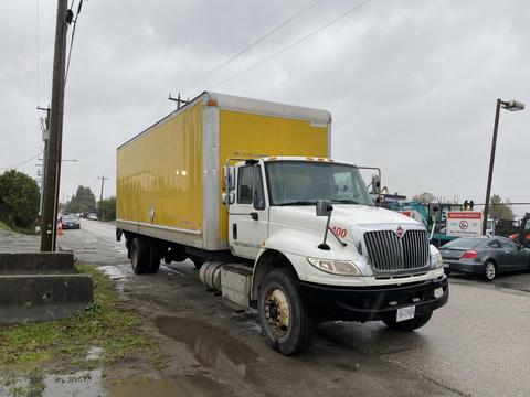 2018 International 26 Foot Cube truck with air brakes and a yellow cargo box parked on the street