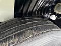 Close-up of a tire from a 2007 International 4200 showing tread and surface details
