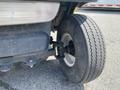 Close-up of a tire on a 1999 Ez-go Industrial vehicle showing tread and rim details