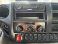 Dashboard of a 2020 Hino 195 featuring a JVC stereo with Bluetooth controls and climate control knobs with settings for airflow and temperature