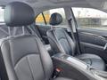 Interior of a 2007 Mercedes-Benz E-Class featuring black leather seats and a sleek dashboard design