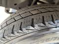 Close-up of a tire from a 2007 Ford Econoline showing detailed tread pattern and sidewall markings