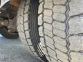 Close-up view of the tire tread of a 2010 Freightliner MT45 Garbage Truck