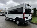 A white 2016 RAM Promaster van with tinted windows and a wheelchair access symbol on the rear