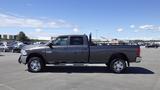 A 2014 RAM 3500 pickup truck parked with a gray exterior and chrome wheels