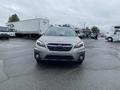 A 2019 Subaru Outback parked with its front view visible showcasing its sleek design and distinctive grille