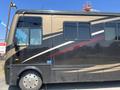 2008 Newmar Canyon Star 36 Foot Class A Motorhome with a sleek black and gold exterior and large windows