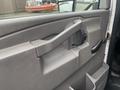 Interior door handle of a 2017 Chevrolet Express with a gray finish and a smooth design