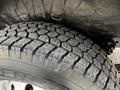 Close-up of a tire from a 2019 RAM Promaster showcasing detailed tread patterns and the sidewall markings