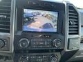 Interior dashboard display of a 2019 Ford F-350 SD showing a rearview camera with guiding lines