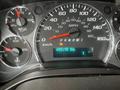 A dashboard display of a 2016 Chevrolet Express showing the speedometer, fuel gauge, and odometer reading 455195 km