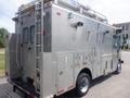 A silver 2007 Morgan Olson Workhorse W42 truck with a heavy-duty body features multiple compartments and a ladder on top