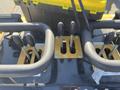 Close-up of the control panel of a 2024 AGT KTT23 Mini Skid Steer featuring several levers for operating the machine