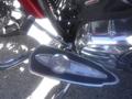 A chrome and black footpeg with an Indian logo attached to a 2017 Indian Chieftain Elite motorcycle