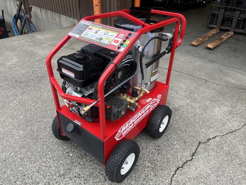 A red 2024 Magnum 4000 Hot Water Pressure Washer with a black engine and wheels visible in the foreground