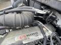 Close-up of the engine components of a 2008 Hino 268 showing pipes hoses and the Hino logo on the engine block
