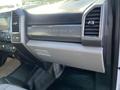 Interior view of a 2019 Ford F-350 SD dashboard featuring the Super Duty branding and air vents