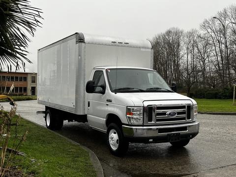 A white 2017 Ford Econoline truck with a boxy cargo area and a grille featuring the Ford logo