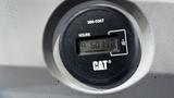 Close-up of the hour meter on a 2018 Cat 326F Track showing 6073.0 hours with a Cat logo