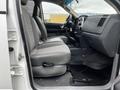 Interior of a 2008 Dodge Ram 5500 showing gray fabric seats and center console with a dashboard and floor mat