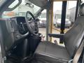 Interior view of a 2017 Chevrolet Express showing the driver seat steering wheel and dashboard controls