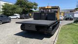 2015 PowerBully Tracked Flat Deck Equipment Carrier with a flat platform and tracked wheels designed for transporting heavy equipment