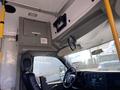 Interior view of a 2017 Chevrolet Express showing the dashboard and driver's seat with a steering wheel and control panel