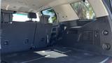 Interior view of a 2018 Chevrolet Tahoe showing the rear cargo area with folded down seats and a spacious floor area