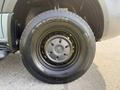 A close-up view of a 2019 Mercedes-Benz Sprinter wheel featuring a black tire with a Mercedes logo on the hubcap
