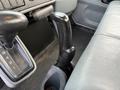 Close up of the gear shift lever and surrounding console in a 2007 International 4200 showing the gear selection numbers