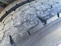 Close-up of a worn tire tread from a 2006 Workhorse W42 showing deep grooves and signs of use