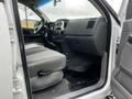 Interior of a 2008 Dodge Ram 5500 showing the driver’s seat dashboard and front passenger seat with gray upholstery