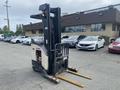 A 2004 Crown RR5210-35 electric forklift with two forks in the front and a yellow and black color scheme