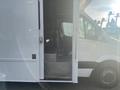 2017 Mercedes-Benz Sprinter van with an open side door revealing steps leading into the interior