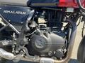 Close-up of a 2022 Royal Enfield Himalayan motorcycle engine showcasing the engine casing and branding details