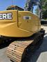 2009 John Deere 135 D excavator with a yellow body and large tracks designed for construction and excavation work