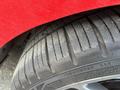 Close-up of a tire on a 2018 Ford Focus showcasing its tread pattern and sidewall details