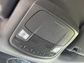 The overhead console of a 2017 Ford F-150 featuring lights buttons for sunroof and other functions