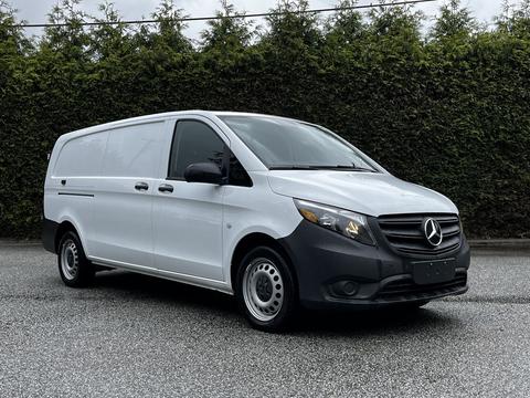 A 2023 Mercedes-Benz Metris van in white with a black front bumper and steel wheels parked facing left