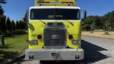 Front view of a bright yellow 1995 Freightliner FLL086 truck featuring a chrome grille and large headlights