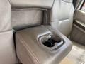Armrest with integrated cup holder in a 2010 Ford F-550 interior