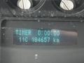 Dashboard display of a 2011 Ford F-250 SD showing timer at 0:00:00 and odometer reading 184557 km with a temperature of 11C