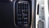 Interior air vent of a 2012 GMC Savana with adjustable slats for air flow management