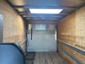 Interior of a 2017 Mercedes-Benz Sprinter van with wooden paneling and a large loading area