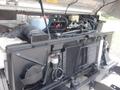 A close-up view of the engine compartment of a 2007 Morgan Olson Workhorse W42 showcasing various components and plumbing including the radiator and hoses